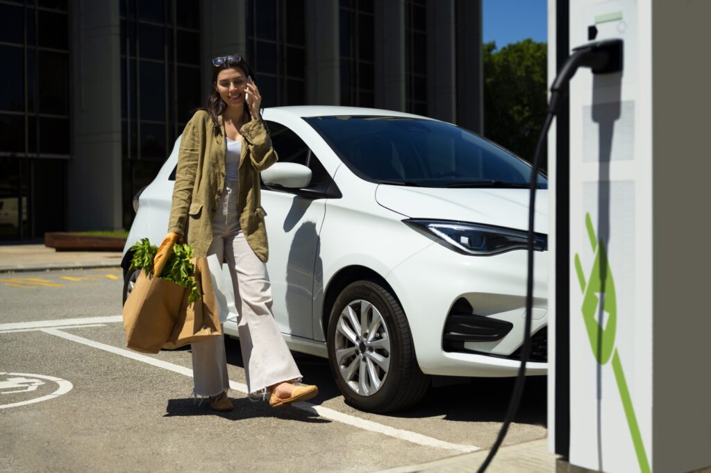 full shot woman holding groceries